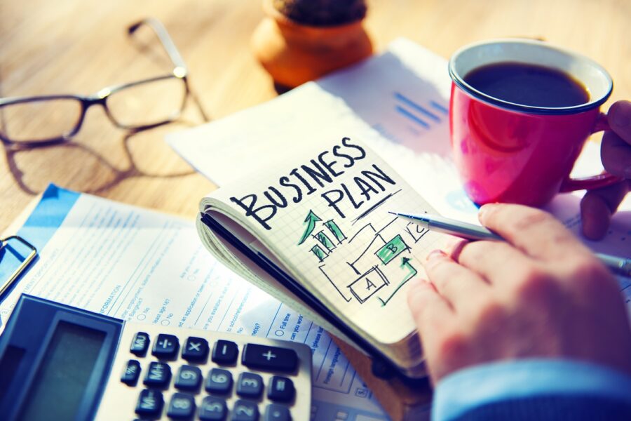 Businessman Writing Business Plan Growth Concept